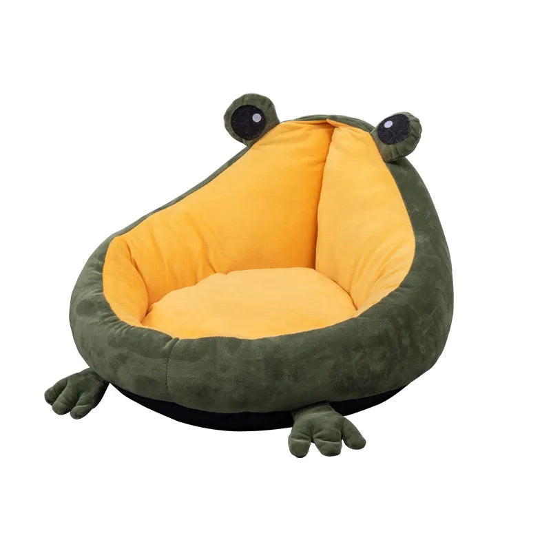 The empty green frog-shaped pet bed with its round eyes, yellow cushion and four plush feet