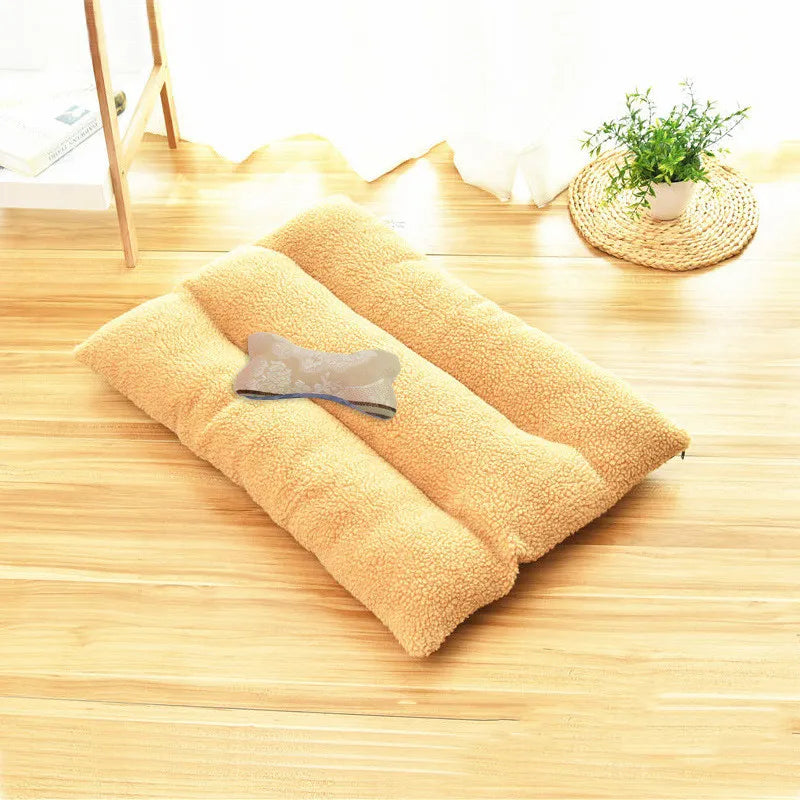 Camel curly-fleece dog cushion on a wooden floor with a bone-shaped cushion on top