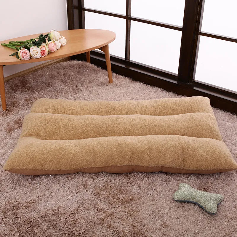 Camel curly-fleece dog cushion with three padded rolls on a shaggy rug