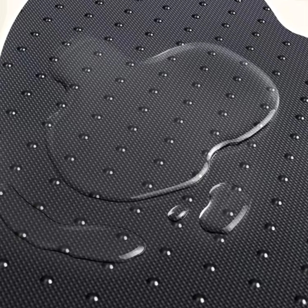 The dark dotted backing on the underside of the paw-shaped mat
