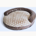 Round dog bed with a taupe leather-look bolster and a beige seat with white dots