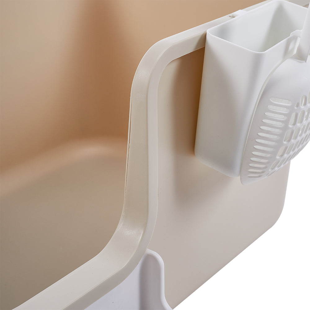 Close-up of the white scoop in its holder on the side of the box