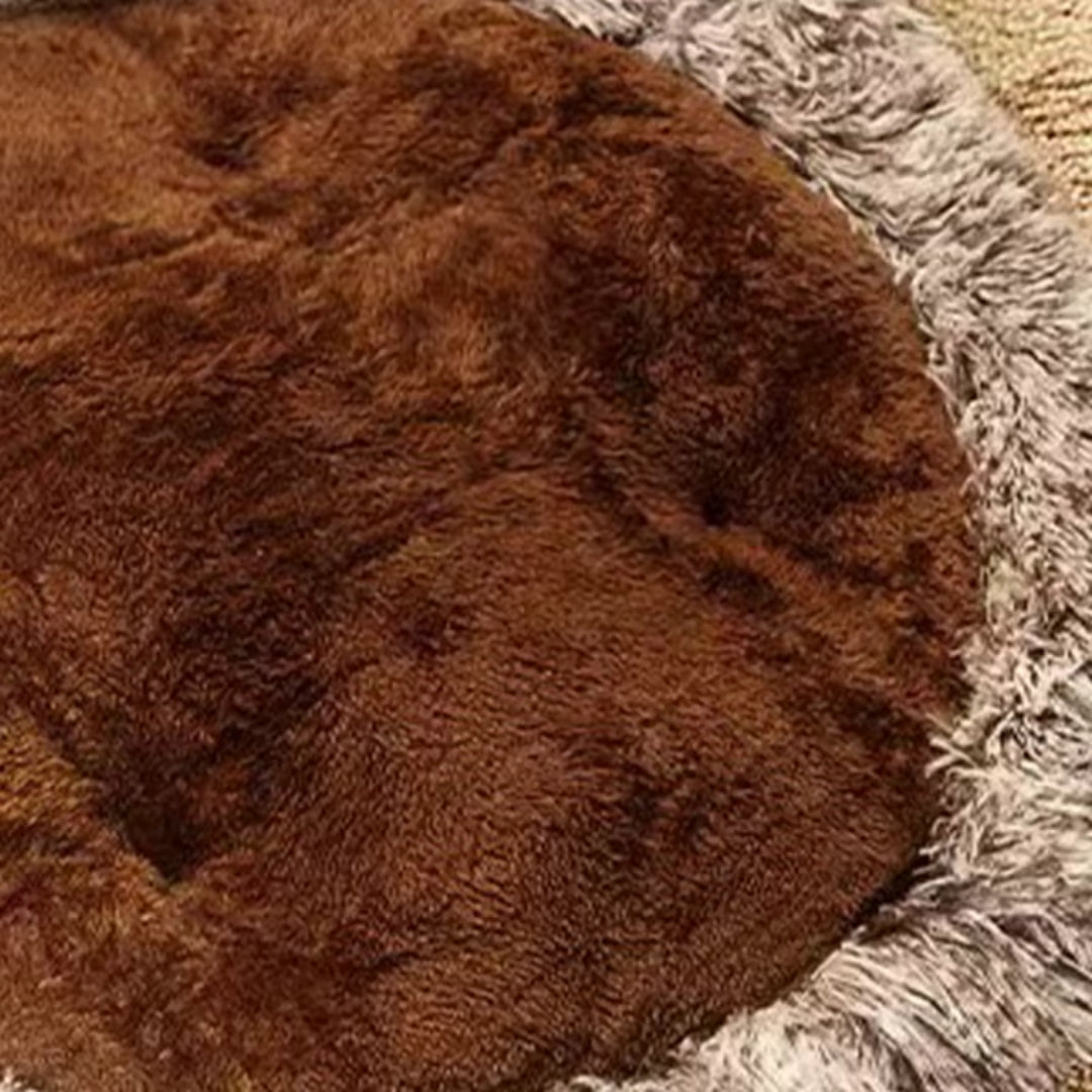 Close view of the brown paw mat's soft centre plush and long shaggy edge