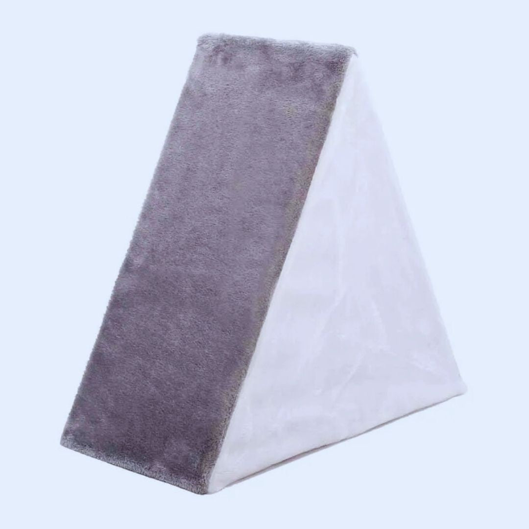 Grey triangle cat house from the back, showing its plush back slope