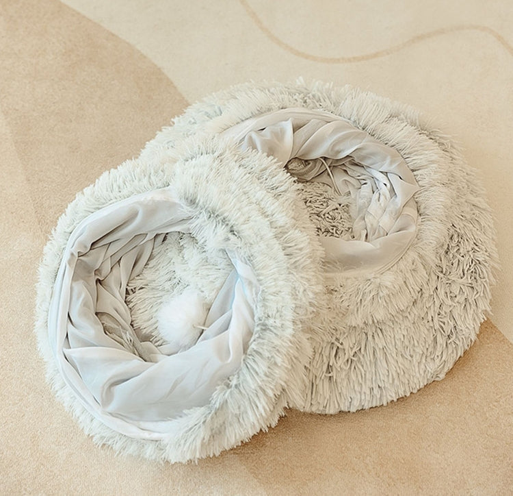 The light grey plush tunnel opened out, showing its smooth grey lining and the white pompom