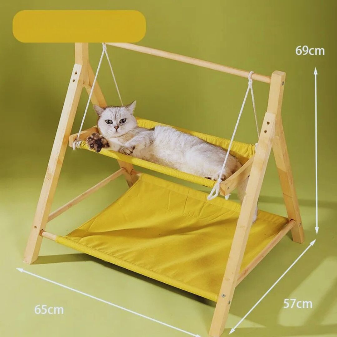 A cat in the yellow swing hammock, with the bed's size: 65 cm long, 57 cm deep, 69 cm high