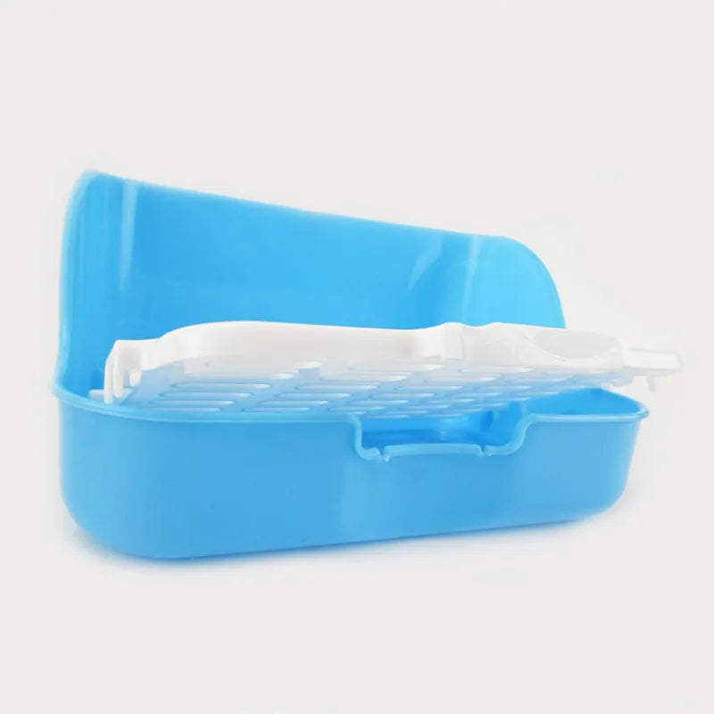 The white grid lifting out of the blue litter tray