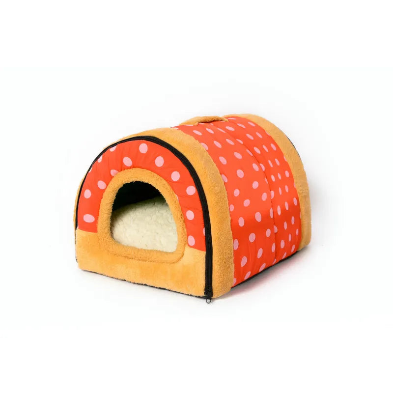 Red polka-dot tunnel pet house with tan plush trim and a cream cushion inside