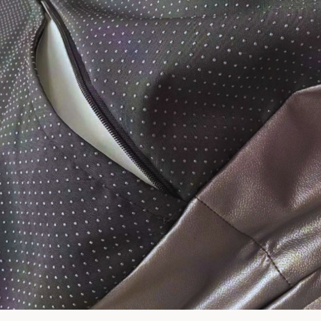 Close view of the zip round the base and the black base fabric with raised dots