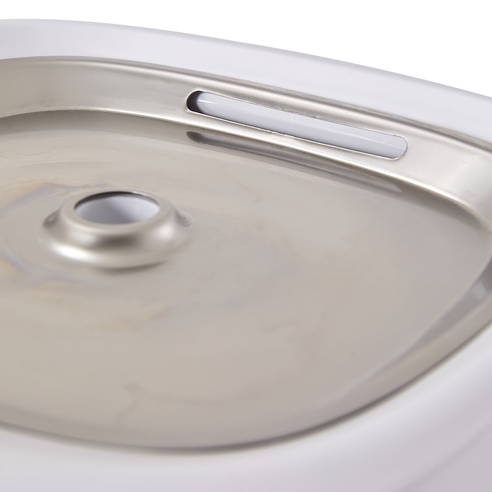 Close view of the stainless steel tray and the water outlet