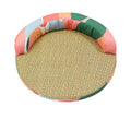 Colour block round cat bed seen from the front, the padded rim round the back half
