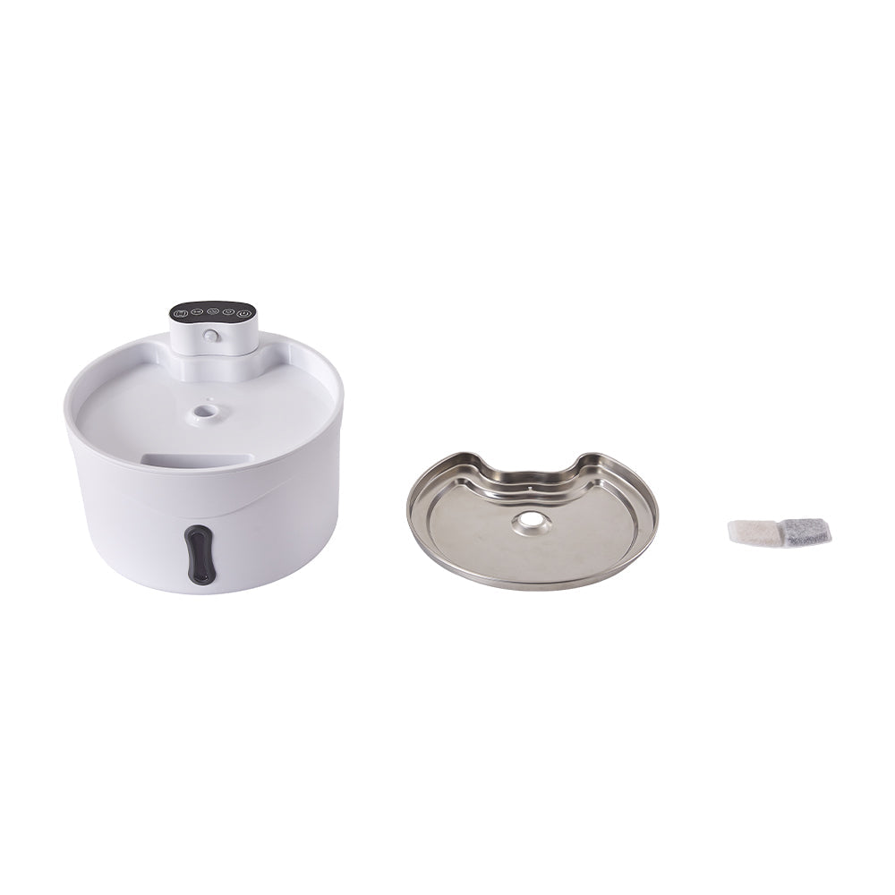 The fountain body, the stainless steel tray and the filter cartridge laid out separately