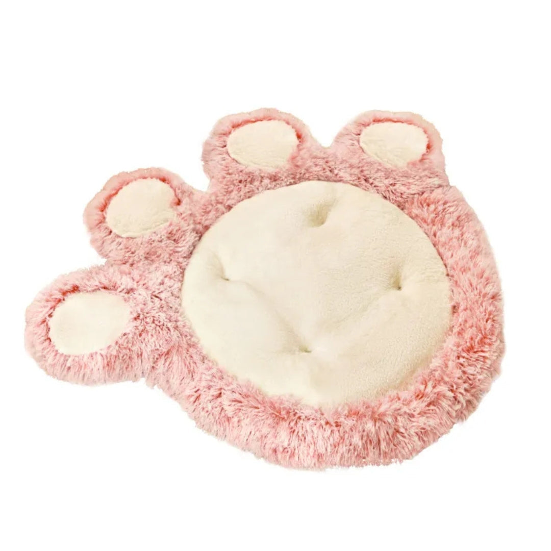 Pink paw-shaped plush pet bed mat with a cream centre and four cream toe pads