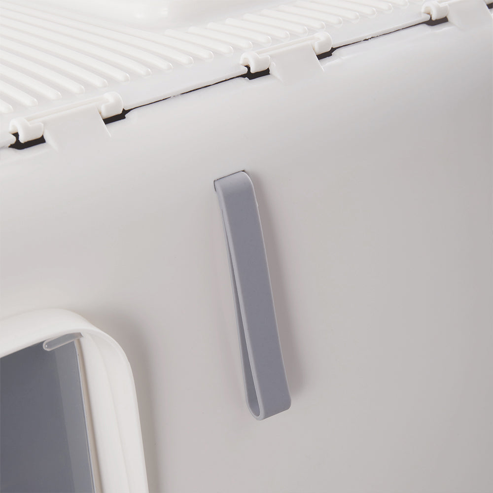 Close view of the grey strap handle on the front of the white hood