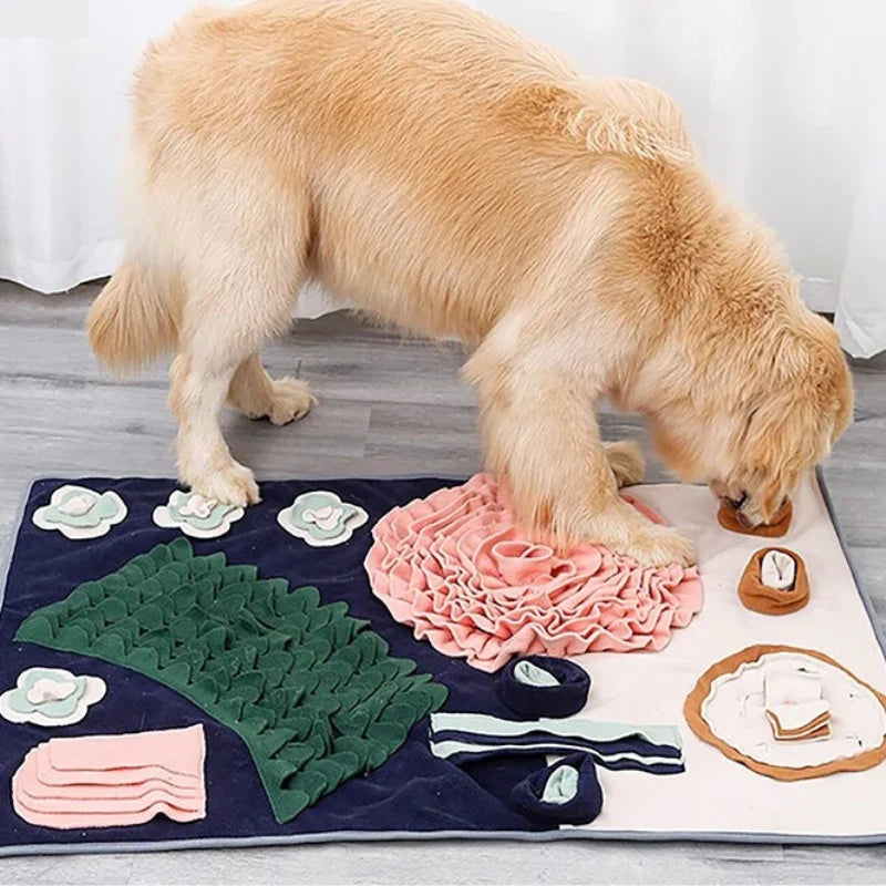 A golden dog sniffing for treats in the pink rose of the snuffle mat
