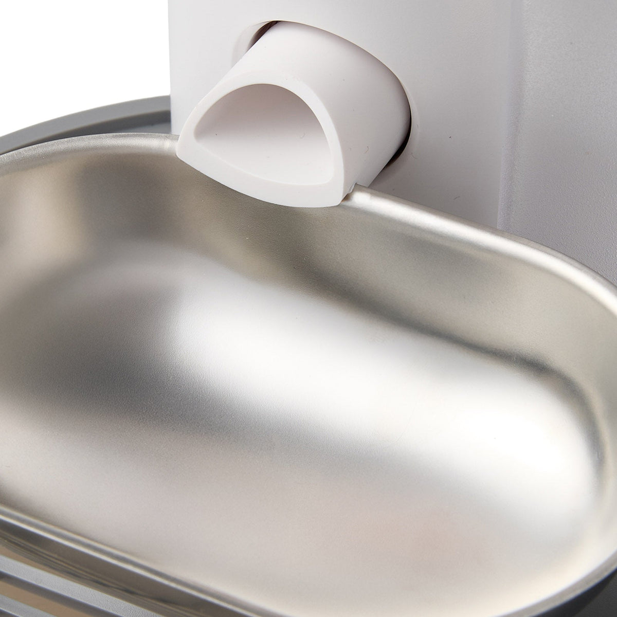 Close view of the spout over the stainless steel bowl