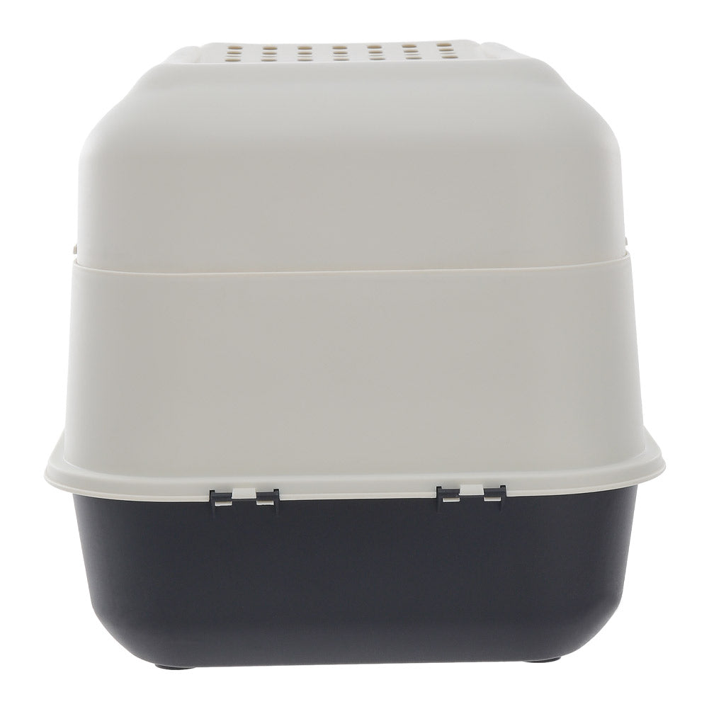 The long side of the hooded litter box, cream hood over the charcoal base