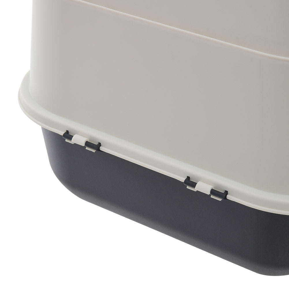Close view of the clips joining the cream hood to the charcoal base