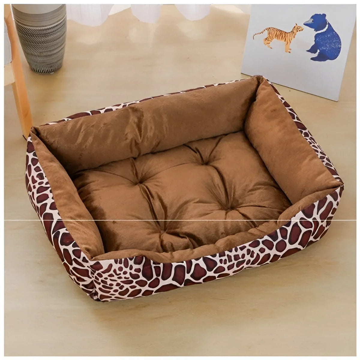 Rectangular dog bed with a brown and cream giraffe print outside and a tufted brown plush seat