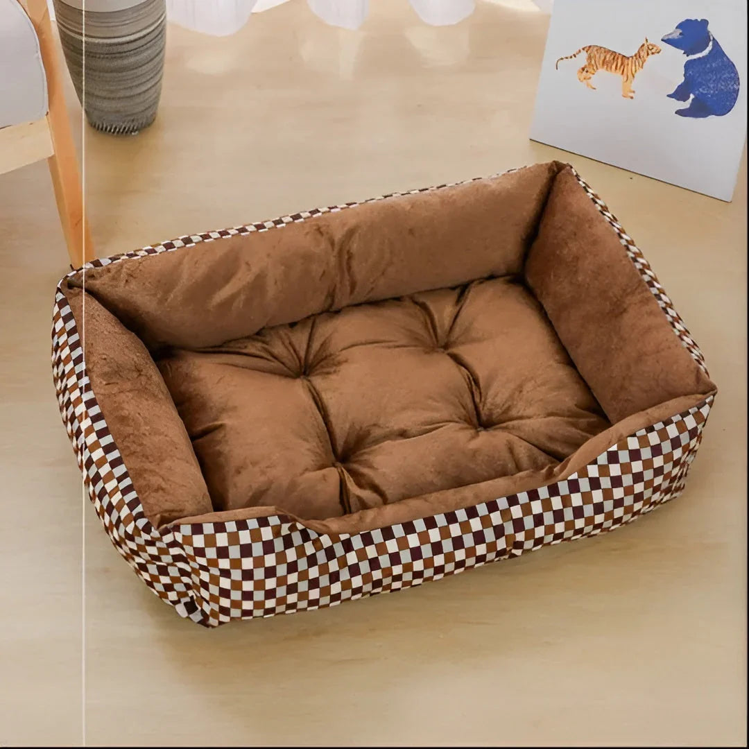 Rectangular dog bed with a brown, tan and cream check outside and a tufted brown plush seat