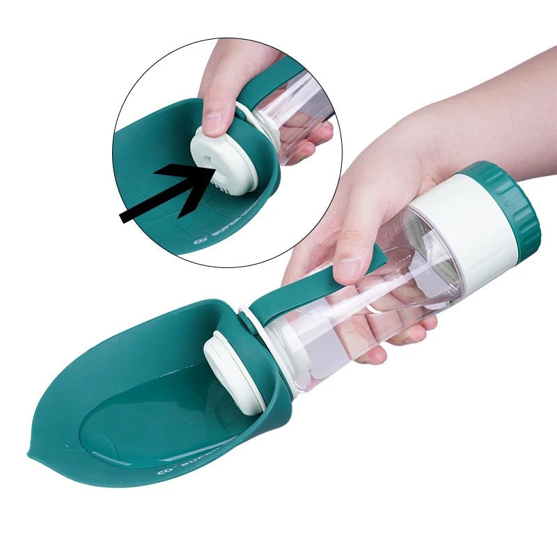 A thumb pressing the button to let water into the trough