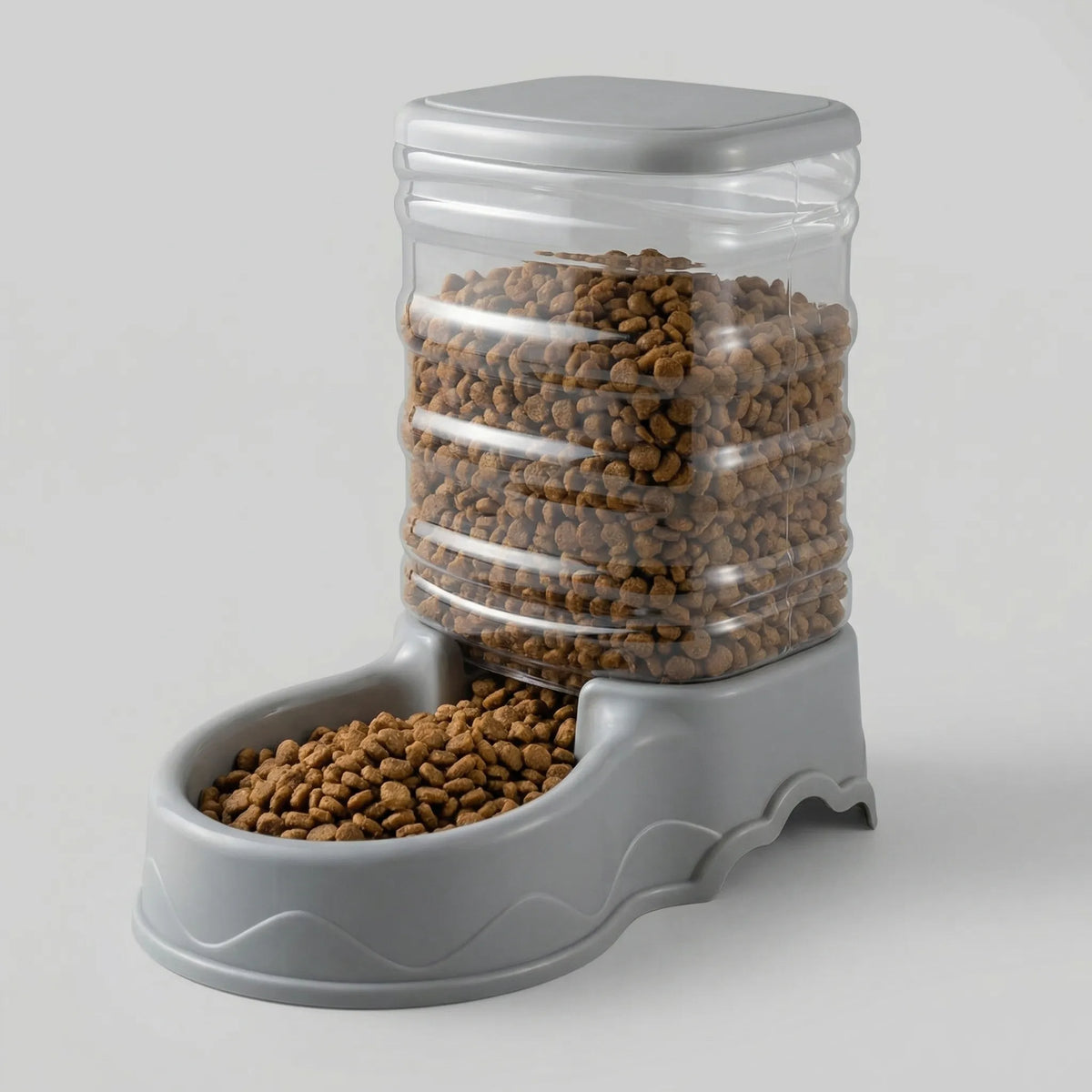 Grey gravity pet feeder with a clear reservoir full of dry food