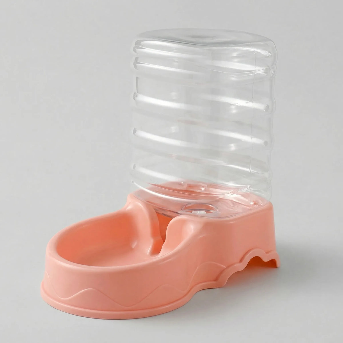 Pink gravity water dispenser with a clear reservoir