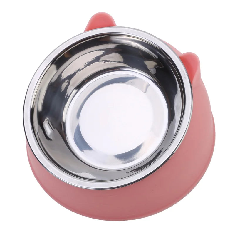 Pink tilted cat bowl with a stainless steel insert, seen from above