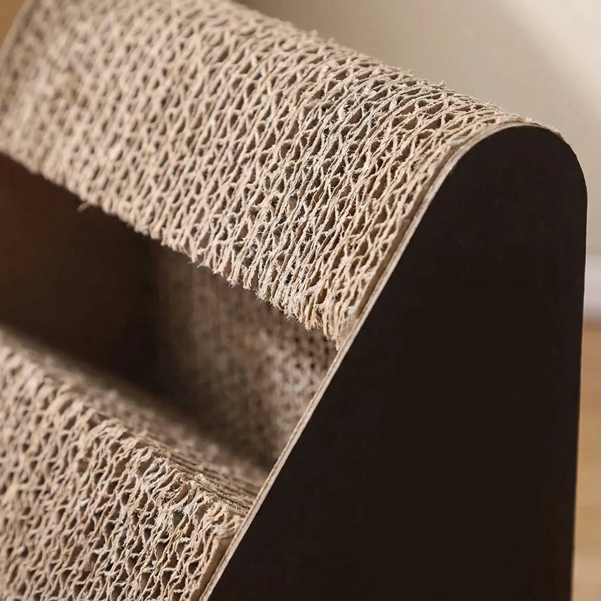 Close-up of the layered corrugated cardboard and the dark frame
