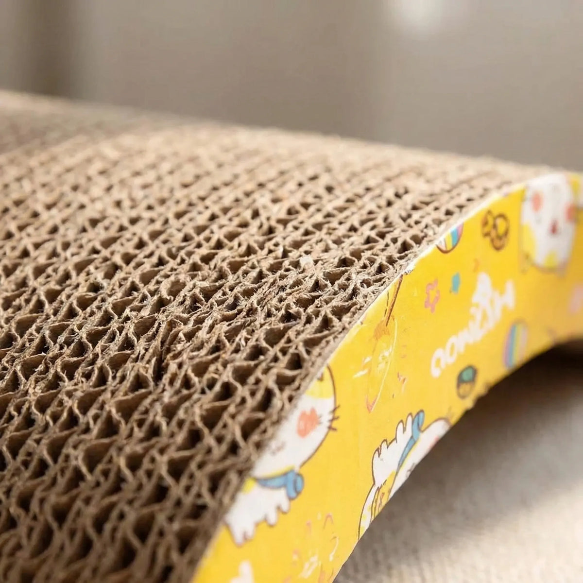 Close-up of the corrugated surface and the cartoon-printed yellow side