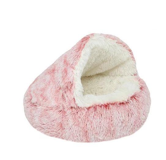 Pink frosted plush hooded cave bed with a cream lining on a white background