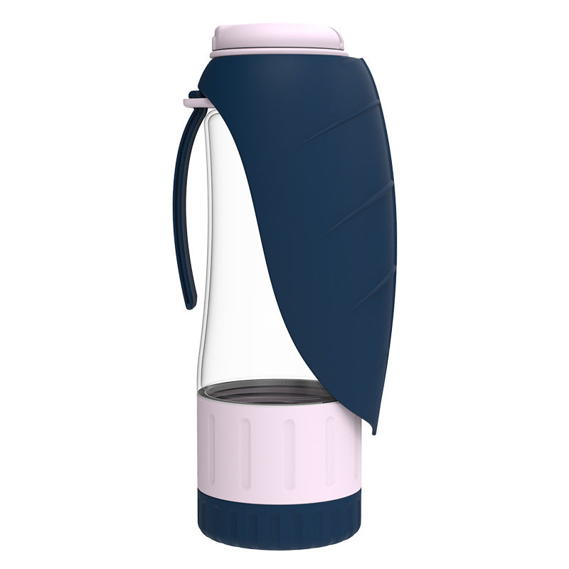 Dog water bottle with a navy leaf-shaped trough and a pink food container