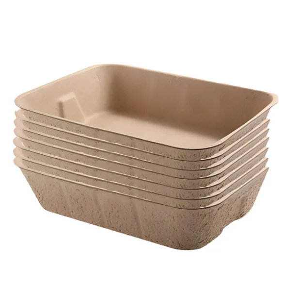 Moulded pulp litter trays stacked inside each other