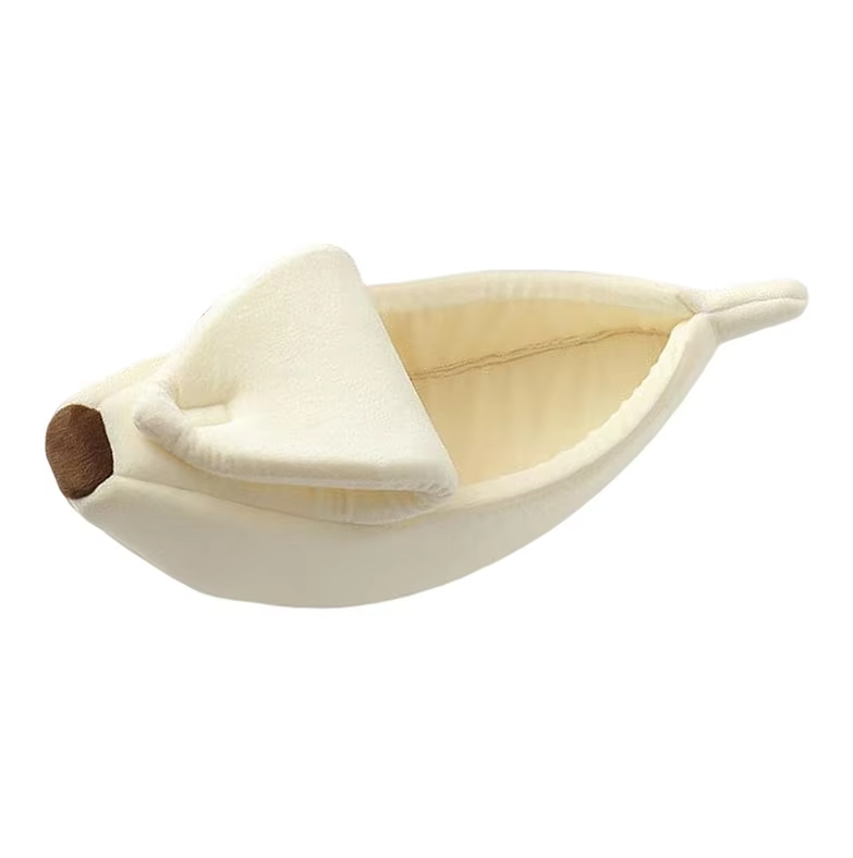 Cream banana cat bed from the side, the peel folded over the front and the brown tip showing