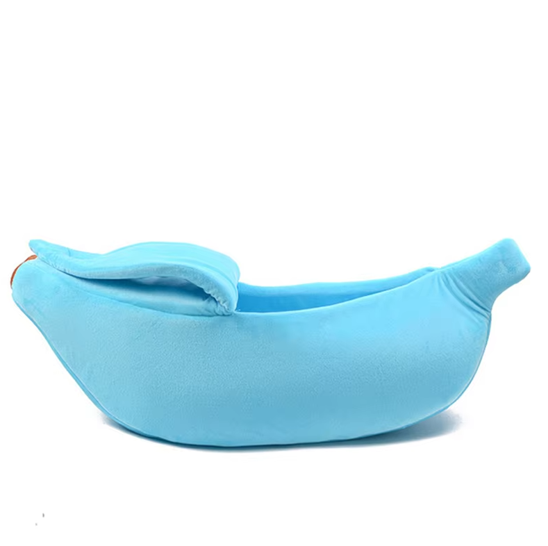 A blue banana cat bed from the side with the peel folded over