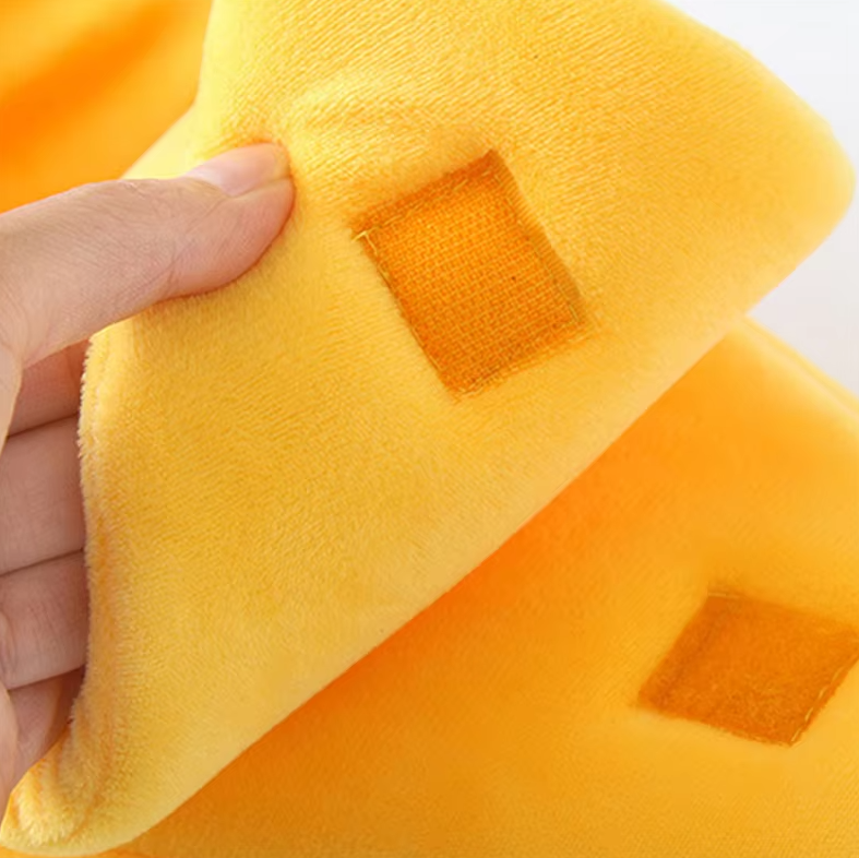 Close view of the hook-and-loop patches on the peel and body of the yellow banana cat bed