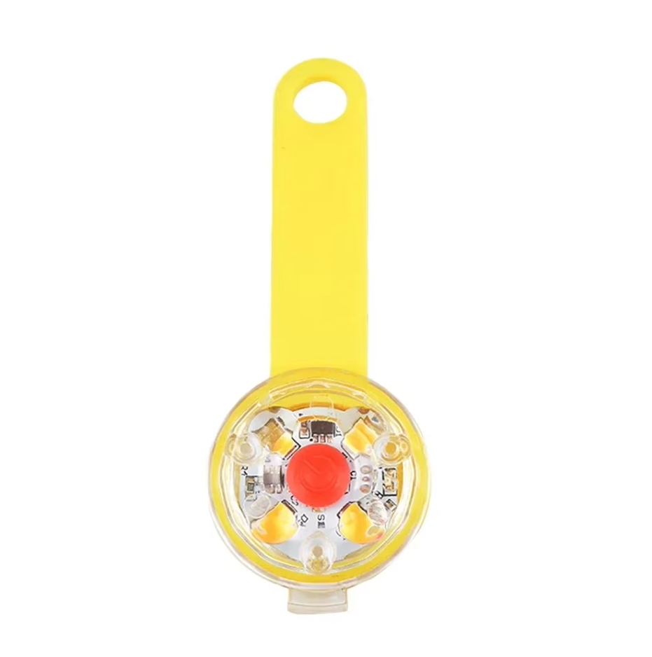 LED collar light with a yellow wrap strap and a clear round housing with a red button