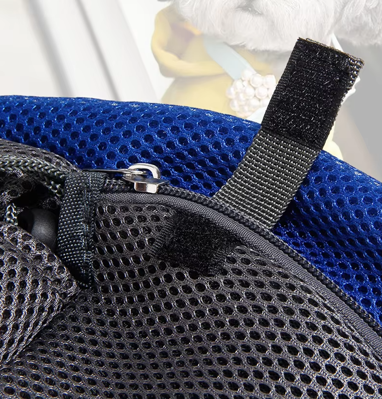 Close view of the blue mesh and the strap tab of the pet sling