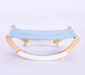 Cat hammock bed with a light blue mesh sling on a pale wooden rocking frame with white rockers