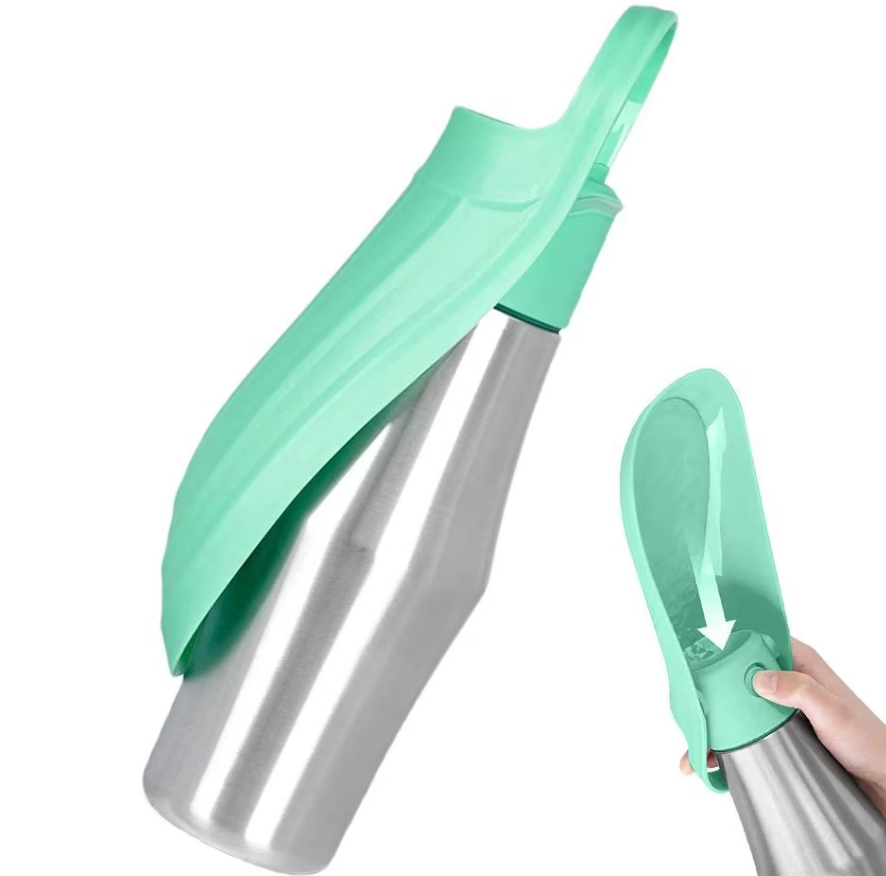 Mint green and steel dog water bottle, a hand turning the trough down for a drink