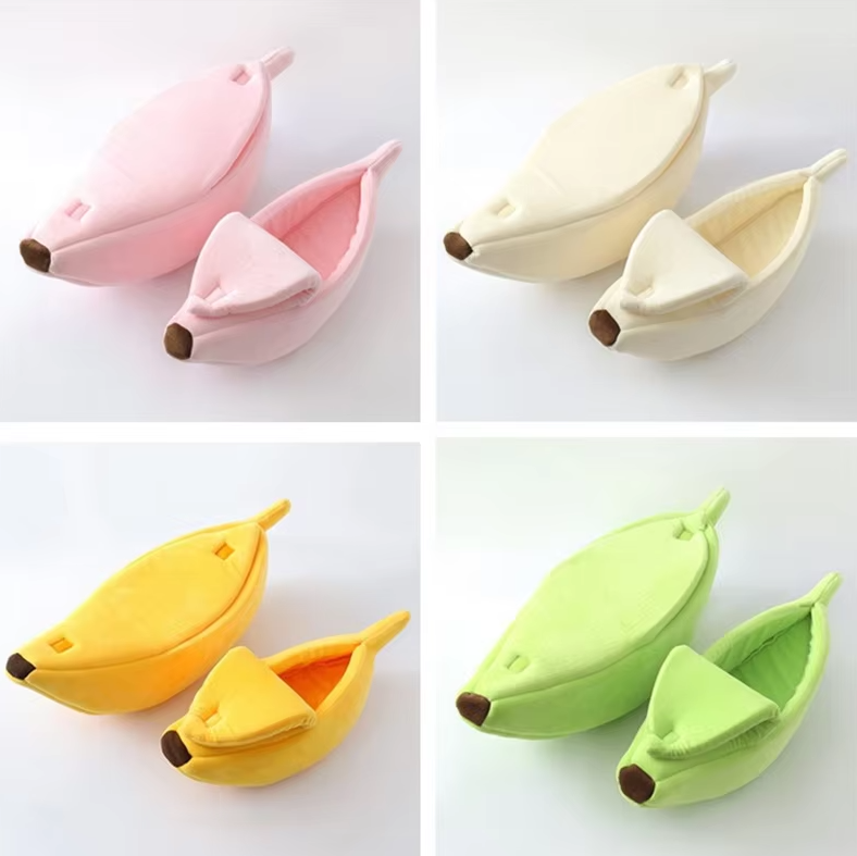 Banana cat beds in pink, cream, yellow and green, two of each colour with the peel open and closed