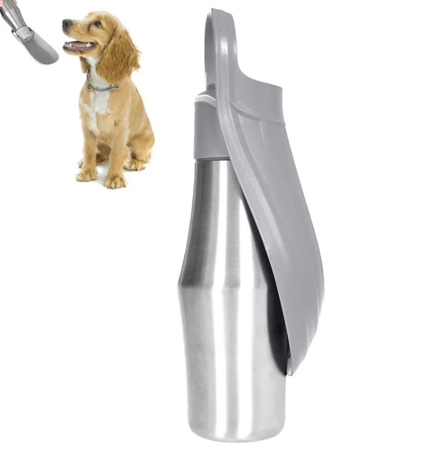 Grey and steel dog water bottle with its trough folded, and a spaniel drinking from the open trough