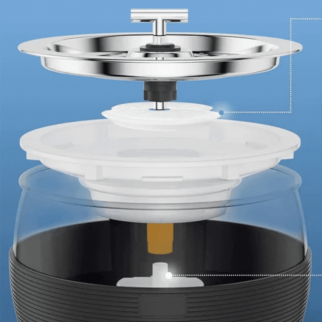 Cut-away view of the fountain: the steel top plate and T-spout lifted off above the filter parts and pump