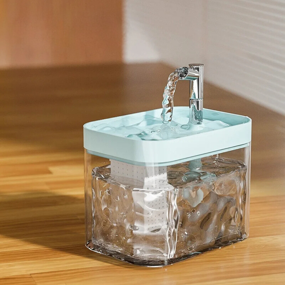 Pet water fountain with a clear wave-pattern tank and a light blue top tray