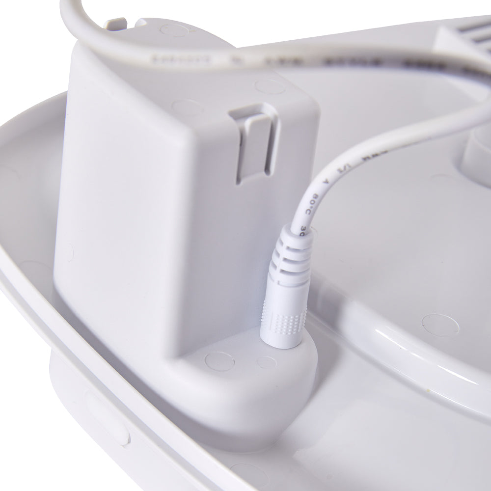 Close view of the control module and its cable inside the fountain