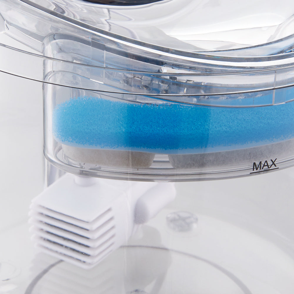 Close view of the blue filter sponge in the top tray and the white pump below it