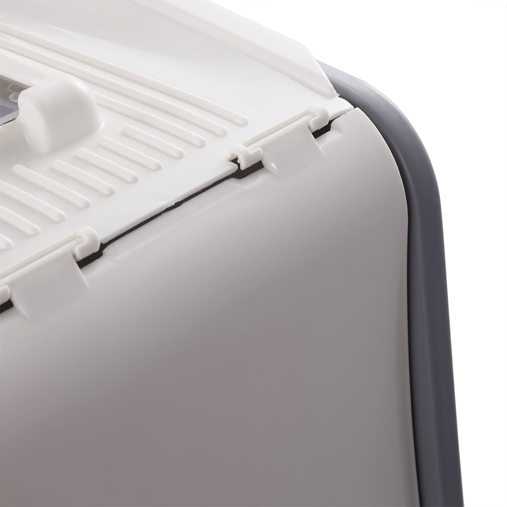Close view of the back corner of the hood with the top flap and its hinge clips