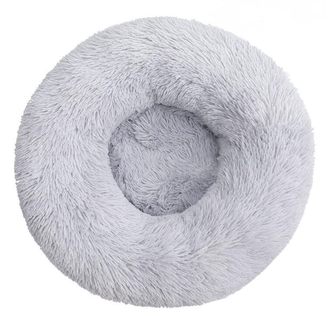Light grey round fluffy donut bed seen from above