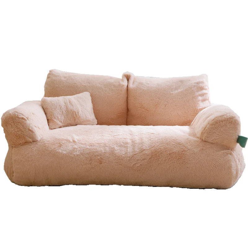 Apricot plush dog sofa bed with two armrests and a small pillow