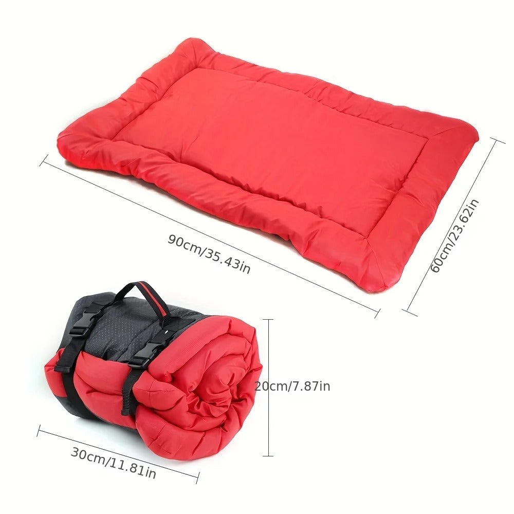 Red travel dog bed laid flat, 90 x 60 cm, and rolled up to 30 x 20 cm with its straps